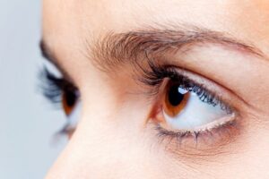 Close-up of model's brown eyes as she looks up